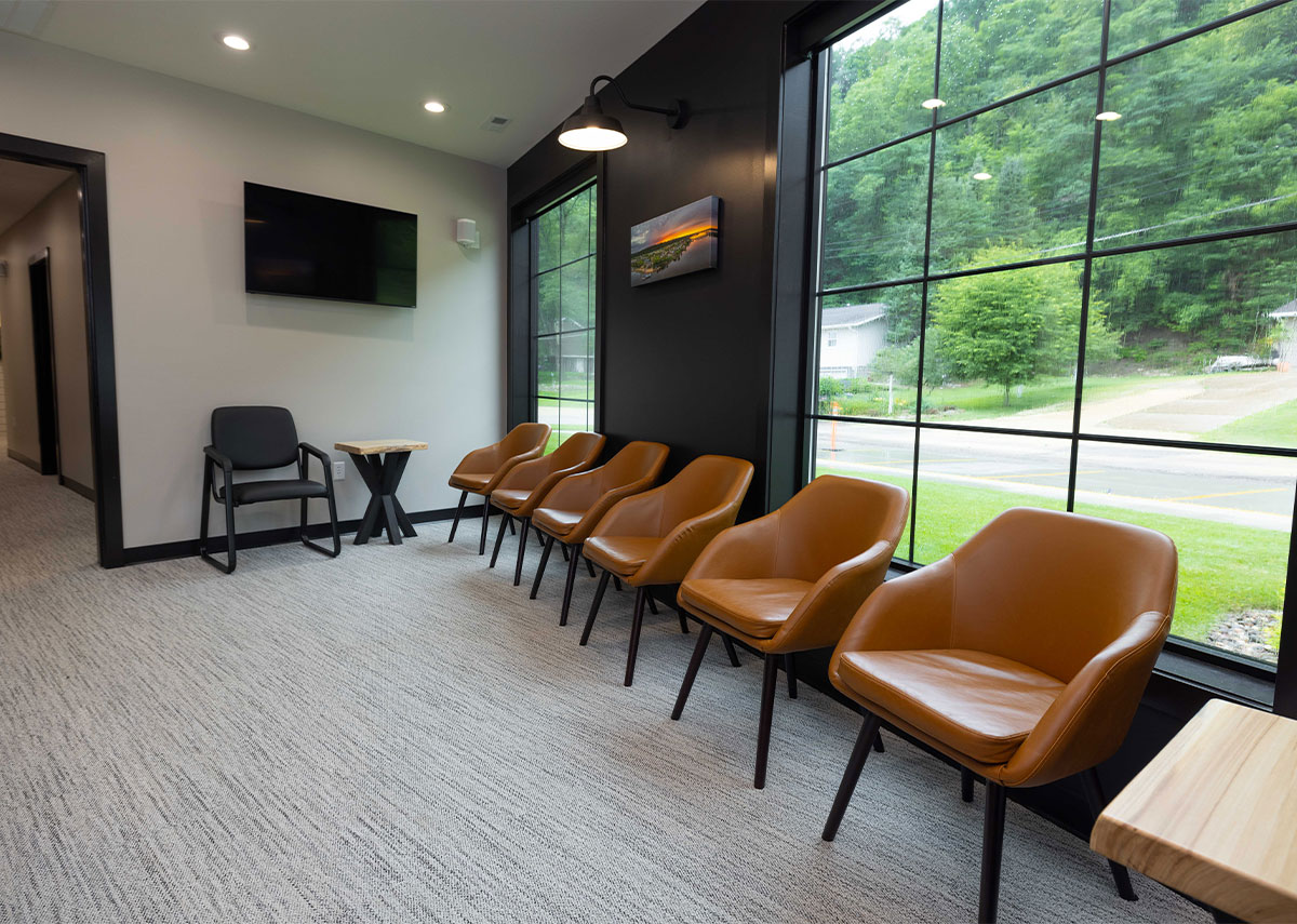 River Town Family Dentistry waiting area with large windows and brown chairs