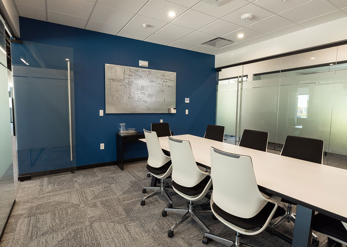 Setpoint Mechanical Meeting Room with large conference table and white board