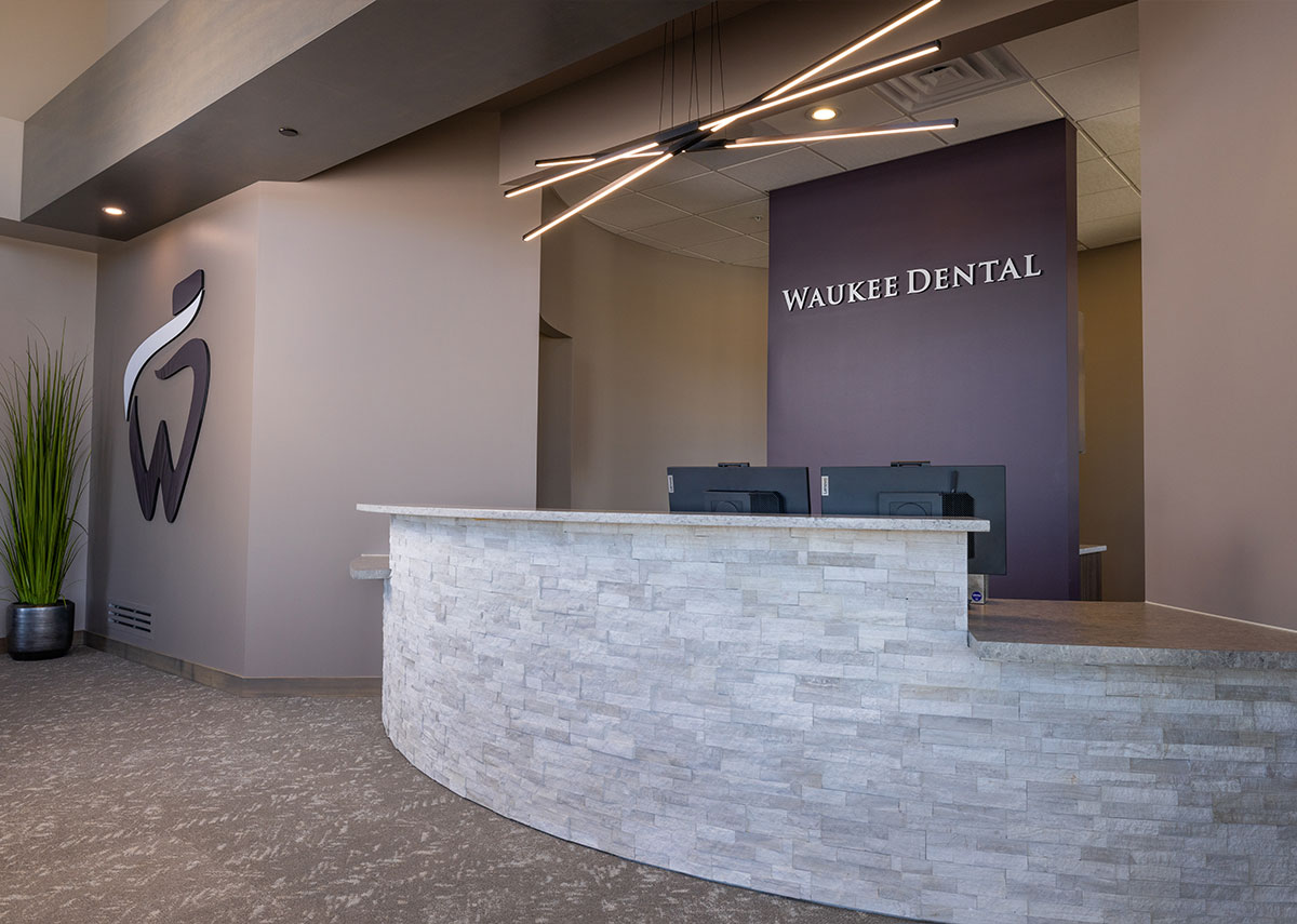 Waukee Dental reception desk with stacked stone
