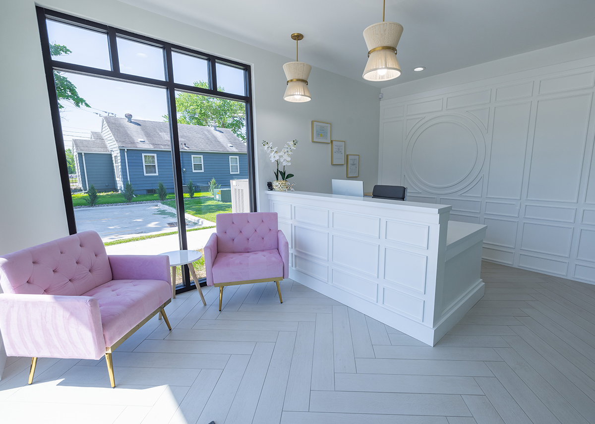 Jones Family Dental hair salon reception desk with two pink chairs