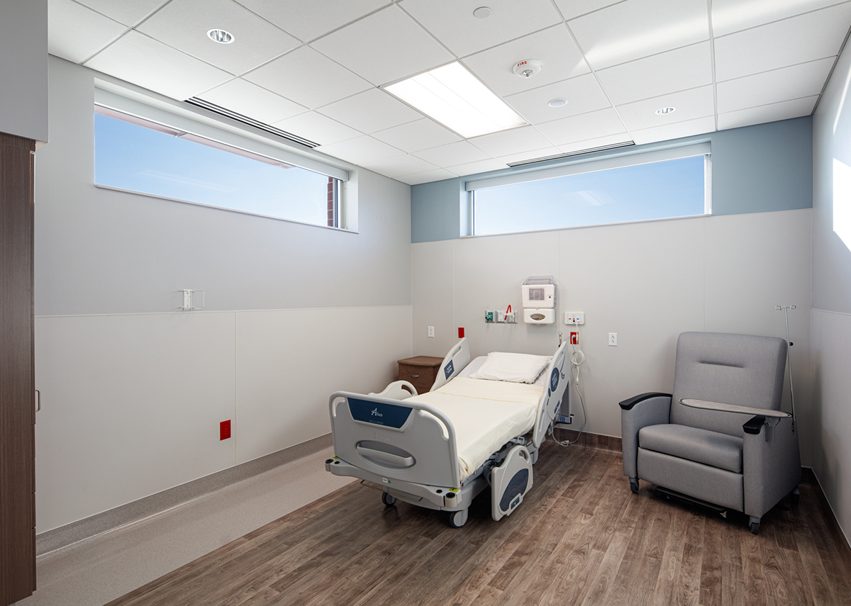 Iowa Ortho Surgery Center private room with bed and chair